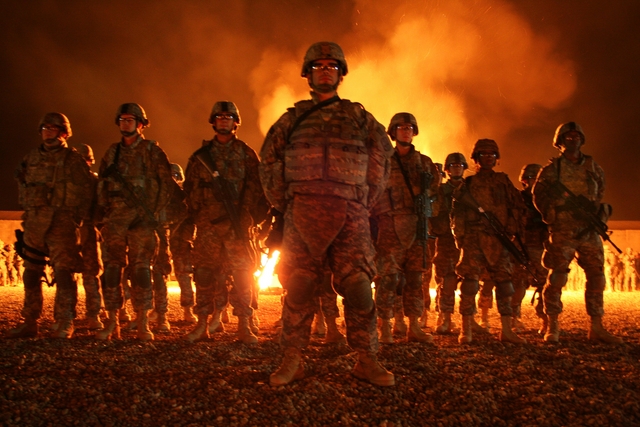 0420-0908-2422-3615_group_of_new_blackhawk_warrior_soldiers_standing_in_front_of_a_ceremonial_bonfire_m
